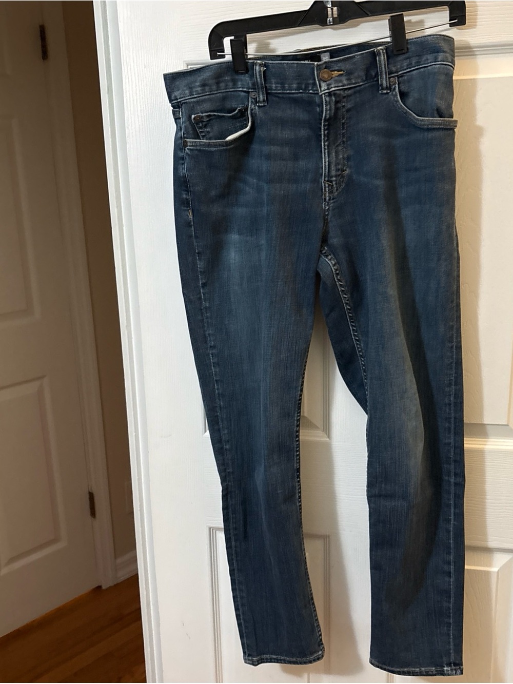 Banana Republic light blue denim jeans with gold stitching